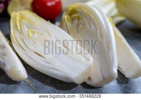 Fresh Belgian Endive Or Chicory Bitter Salad Ready To Cook Or Eat