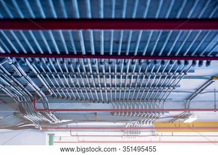 Blurry Picture Of Electrical Conduit And Cabling. Blurry Image For Construction Background.
