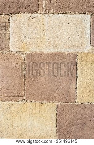 Sandstone Block Wall In Red And Yellow Shades For Background