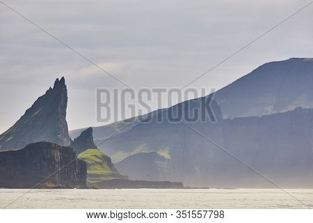 Faroe Islands Sunset Dramatic Coastline Landscape In Vagar Island. Seascape