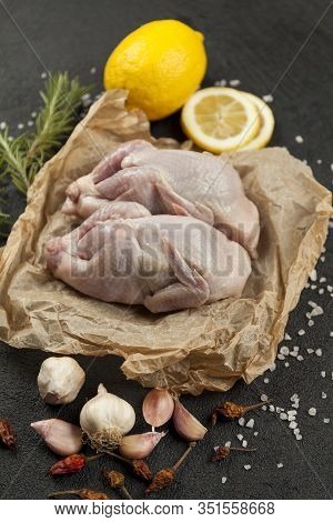 Raw Quail Meat On Kitchen, Cooking Gourmet Bird. Healthy Diet Recipe.