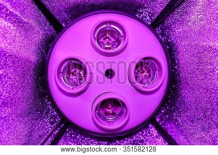 Four Empty Cartridges In A Ceiling Without Lamps In A Studio Softbox With Reflectors Stand In The Li