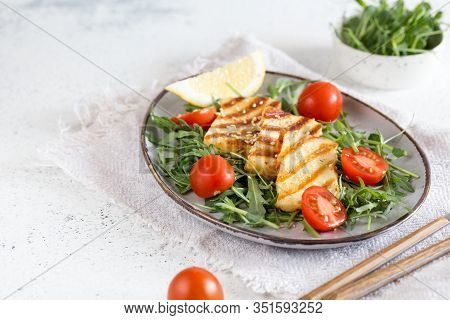 Fresh Salad With Grilled Halumi Cheese, Cherry Tomatoes And Arugula. Copy Space.