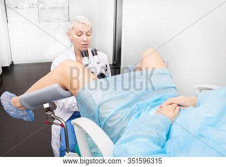 Colposcopy, Examination Of The Cervix. Gynecologist With Colposcope During Examination Of A Woman Pa
