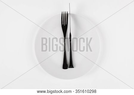 Cutlery Language, Dining Etiquette. Excellent Food. White Ceramic Round Plate With Knife Anf Fork Is