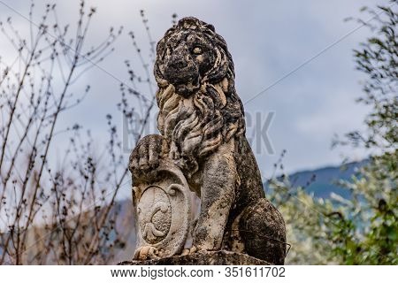 Puget-theniers, France - January 23, 2020: A Statue Of A Lion Holding The 'fleur-de-lis' Emblem ('fl
