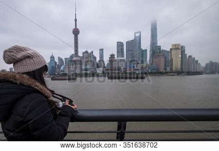 Shanghai, China - January 09 2020: The Unspecific Girl At The Shanghai Waitan 