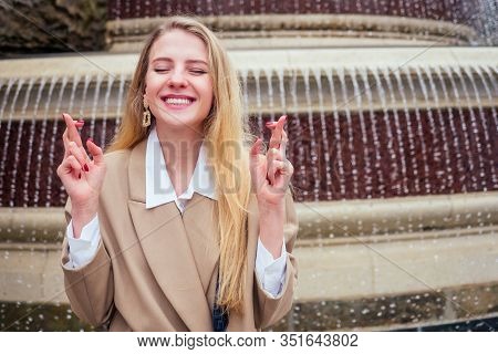 Young Blonde Woman Makes A Wish At The Prague Chezh Fountain