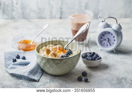 Breakfast With Milk Rice Porridge With Banans, Blueberry And Orange Jam, Creamy Rice Pudding Or Fren