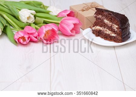Bouquet Of Pink Tulips, Chocolate Cake. Pressent Box On White Wooden Background. Copy Space, Close U
