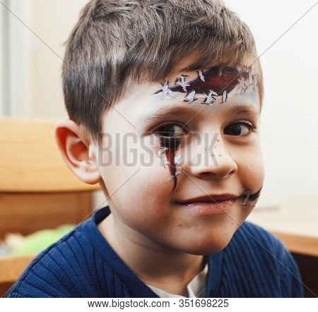 Little Cute Child Making Facepaint On Birthday Party, Zombie Apocalypse Facepainting, Halloween Prep