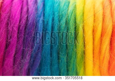 Yarn in spectrum of colors. Reel of colorful yarn. Shallow depth of field.