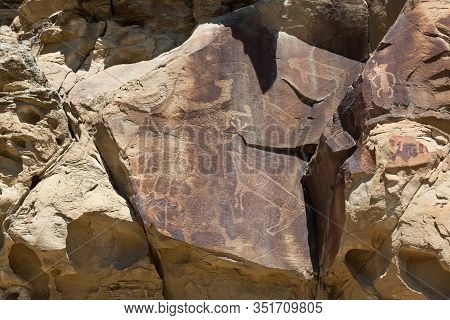 Strange Shapes And Figures That Have Been Carved Into The Ancient Sandstone Rocks At Legend Rock Sta