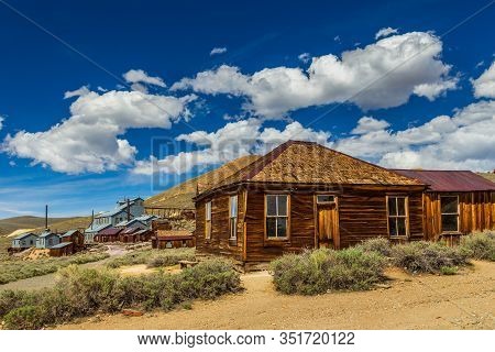 View Of The Bodie, Ghost Town. Bodie State Historic Park. Abandoned Wooden Houses And Standard Conso