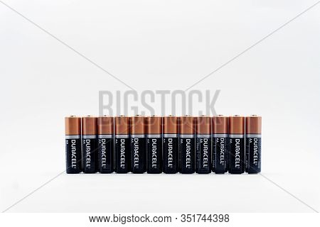 Duracell Batteries In A Raw On White Background, Copy Space, Front View