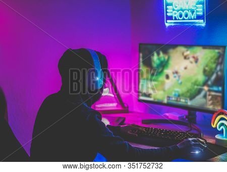 Young Streamer Gamer Playing At Strategy Game In Broadcast Browser - Male Guy Having Fun Gaming And 