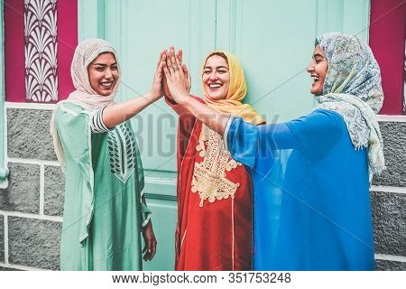 Young Arabian Girls Stacking Hands Outdoor - Islamic Happy Women Celebrating Together - Youth Lifest