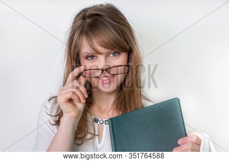 Happy Graduate Woman With Her Dissertation Work On White - Education Concept