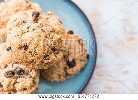 Fruit Scones - Freshly Baked Raisins And Cinnamon Scones On Vintage Plate