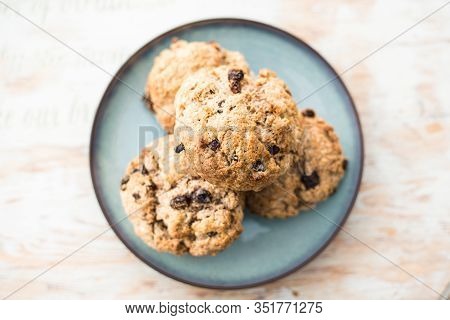 Fruit Scones - Freshly Baked Raisins And Cinnamon Scones On Vintage Plate