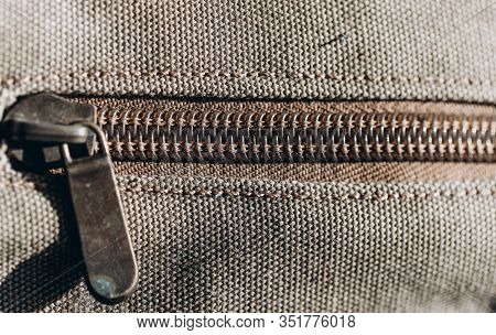 Close-up Of A Vintage Zipper On Color Haki Cloth.