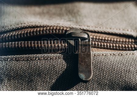 Close-up Of A Vintage Zipper On Color Haki Cloth.