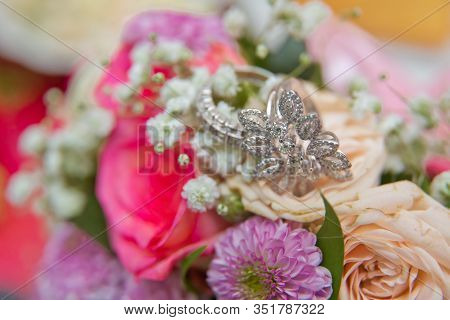 Close Up Wedding Ring On Top Of A Colorfull Bouquet. . Macro .close Up Of Wedding Rings On The Bouqu