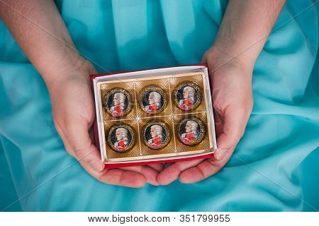 Tambov, Russian Federation - February 14, 2020 Open Box Of Mozart Candies In Woman Hands.