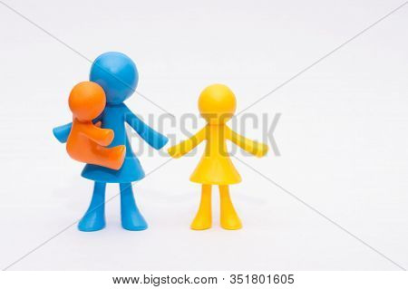 Concept Of A Single Parent With Children, Meeples, Simple Colorful Figures, Isolated On White