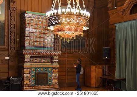 Saint Petersburg, Russia - January 29, 2020: Chandelier And Tiled Stove In The Interiors Of Vladimir
