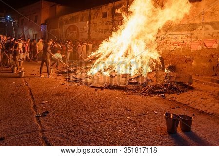 Vrindavan, India - March 20, 2019: People Pulling Out Coal Denoting The Mythical Figure Of Prahlad F
