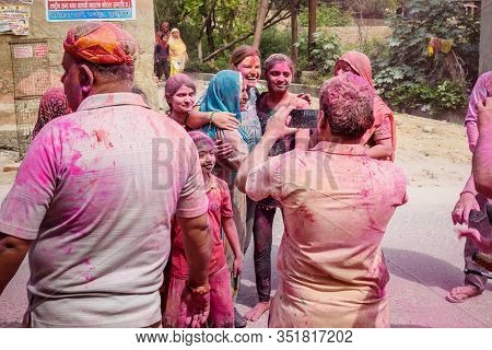 Vrindavan, India - March 21, 2019: Indian People In Different Colours Celebrate Traditional Holi Fes