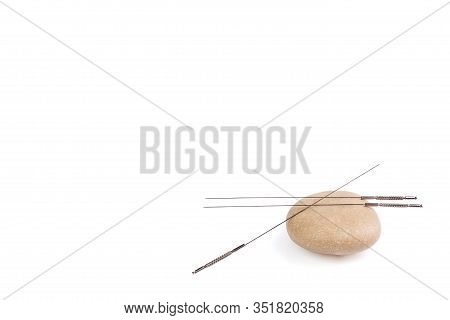 Silver Needles For Traditional Chinese Medicine Acupuncture. Close-up. Isolated White Background. Th