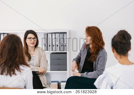 Group Of Women Supporting Each Other At Therapy Session