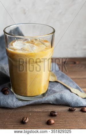 Glass Of Iced Coffee With Ice And Milk