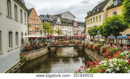 Saarburg, Germany - September 13 2019: City Center Of Saarburg With Creek And Restaurants At The Pro