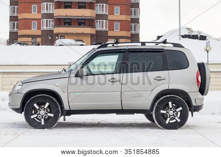 Novosibirsk, Russia - 02.18.2020: Side View Of A Chevrolet Niva, A Russian-american Car In The Snow 