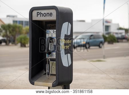 Public Pay Phone Next To A Busy Street