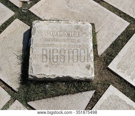 Polignano A Mare, Italy - Sept 17, 2019: Statue Of The Italian Singer And Songwriter Domenico Modugn