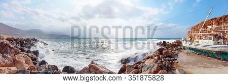 Old Abandoned Ship On The Beach. Storm On A Summer Day In The Mediterranean. Panorama Of The Mediter