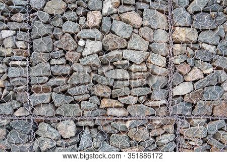 Close-up Of Gabion, Fence Made Of Stones In Metal Mesh For Use In Civil Engineering, Road Building L