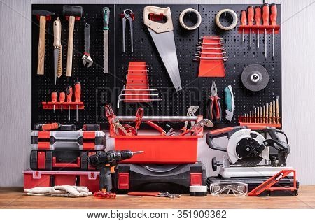 Toolkit Tools On Metal Board In Garage