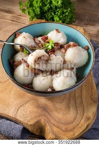 Meat Stuffed Potato Dumplings With Fried Onion And Greaves.
