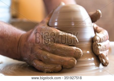 Working Process Of Loam Item In Workshop. Man Working In Home Studio. Craftsman At Work.
