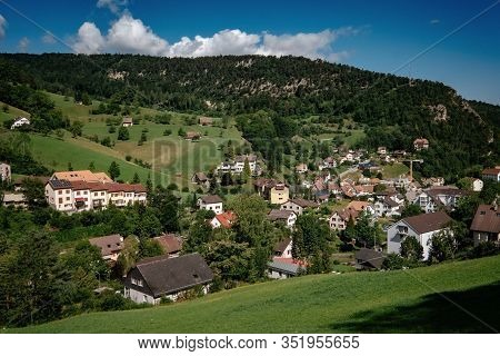 Summer View Of A Beautiful Apline Village In Switzerland