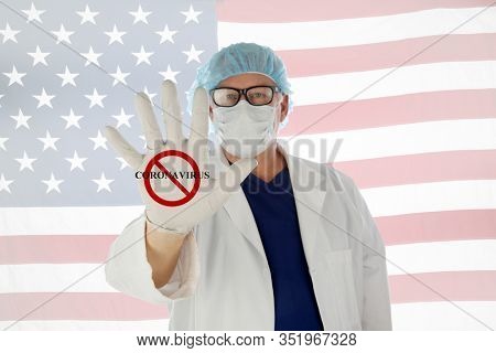  Coronavirus. COVID-19.  Coronavirus Disease 2019. A Doctor holds his hand out with the NO CORONAVIRUS logo. COVID-19 AKA Corona Virus is spreading world wide. COVID-19 is also in the United States. 
