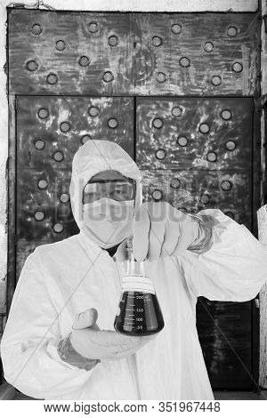   Coronavirus. COVID-19.  Coronavirus Disease 2019. A Doctor holds in his hands a beaker of CORONAVIRUS. COVID-19 AKA Corona Virus is spreading world wide. COVID-19 is also in the United States. 