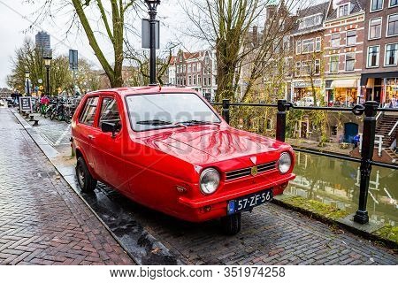 Utrecht, Netherlands - January 08, 2020. Old Three Wheels Red Car Reliant Robin