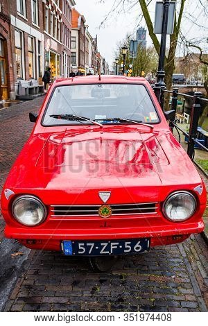 Utrecht, Netherlands - January 08, 2020. Old Three Wheels Red Car Reliant Robin