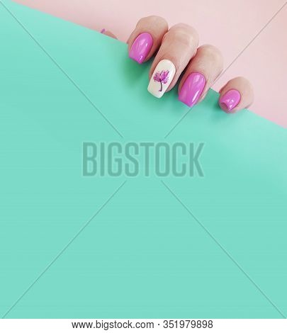 Female Hand Nail Beautiful Manicure On A Colored Background